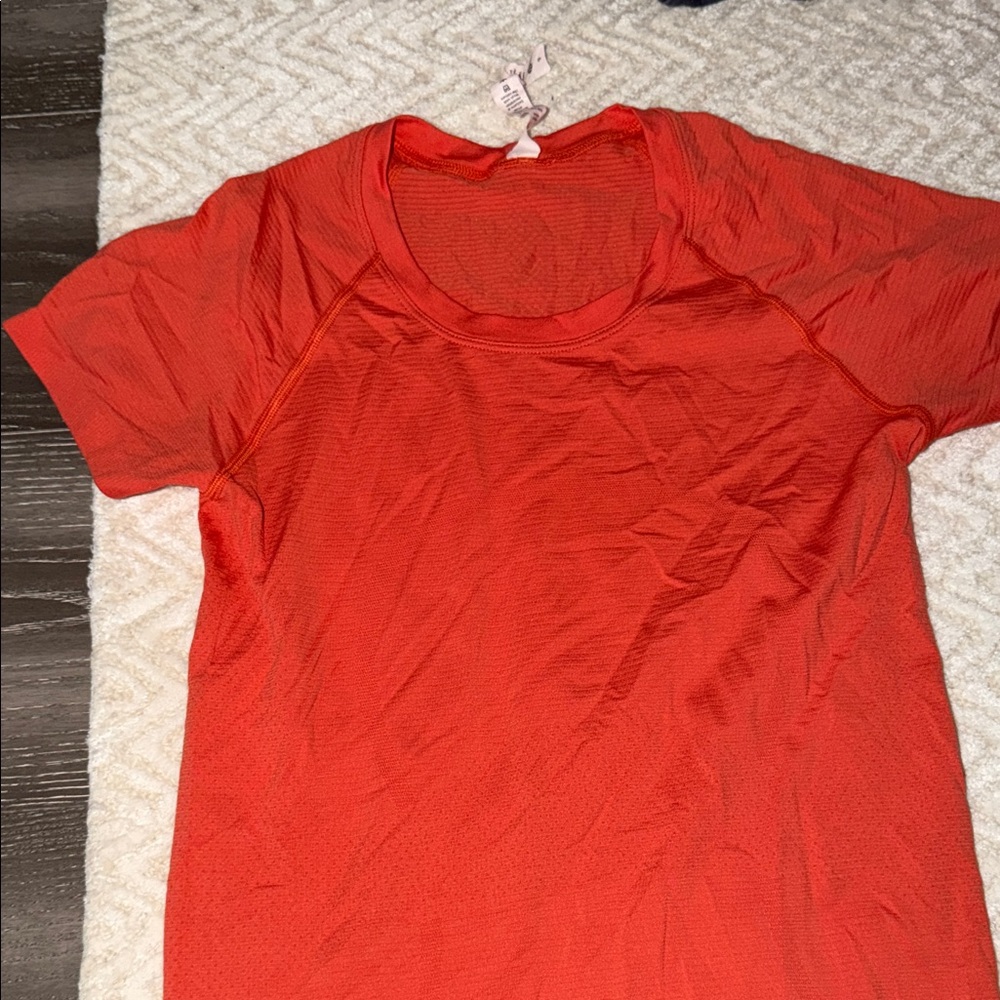 Orange lululemon swiftly tech